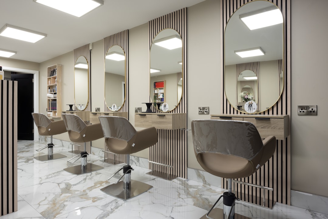 A hair salon with chairs and mirrors